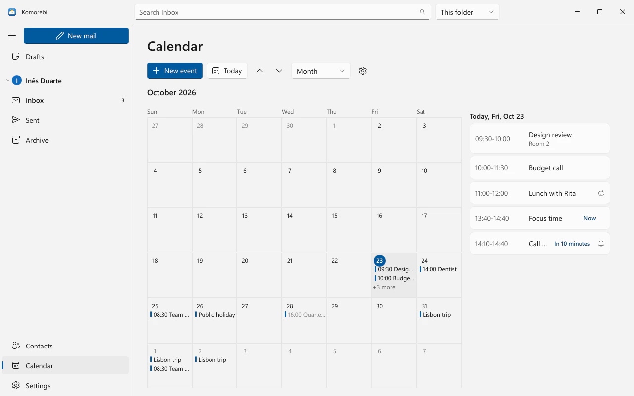 The calendar month view with sample events and the selected day's agenda beside it